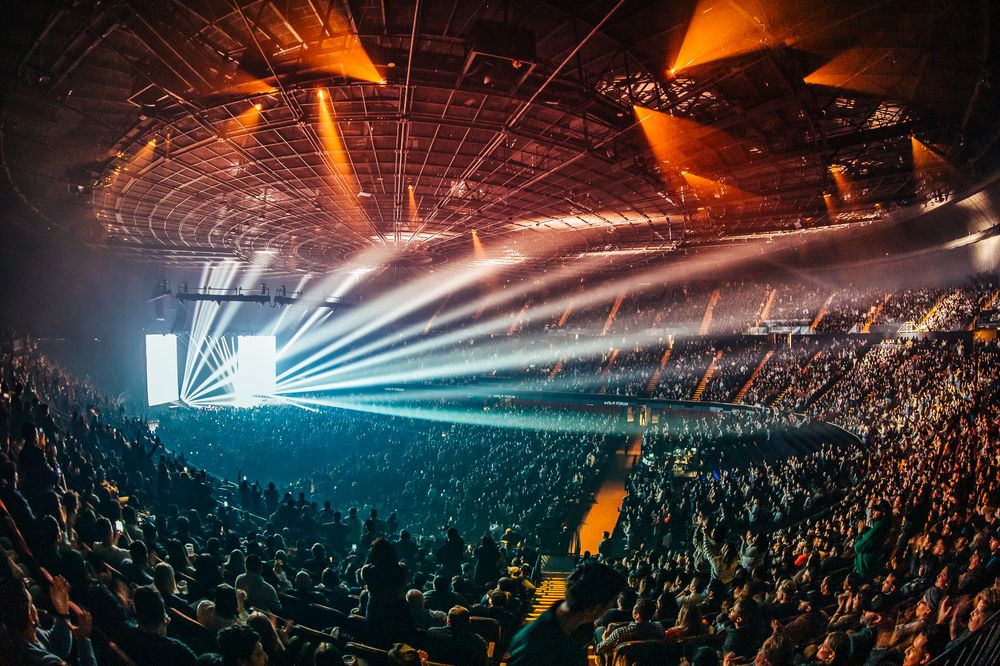 Kia Forum arena show with beam lighting over the crowd